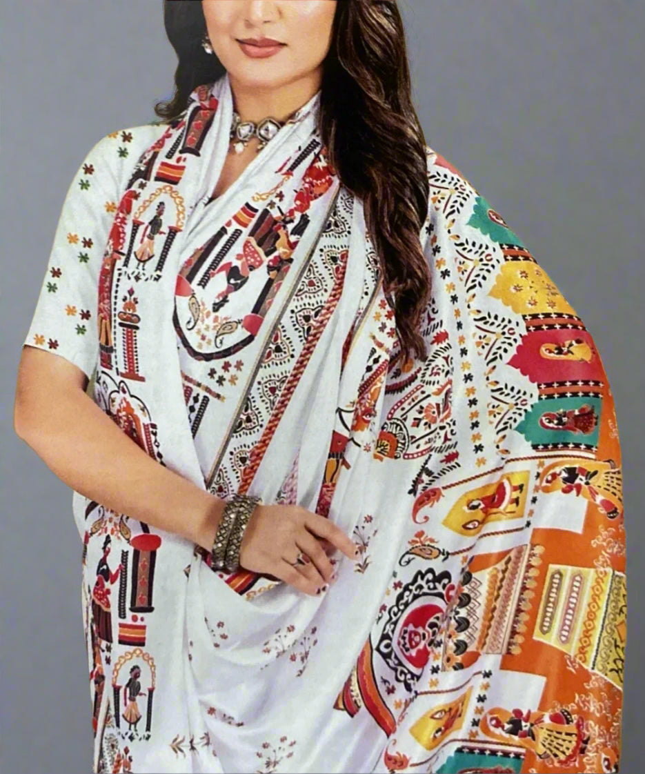 Woman wearing a colorful patterned formal saree in shawl style.