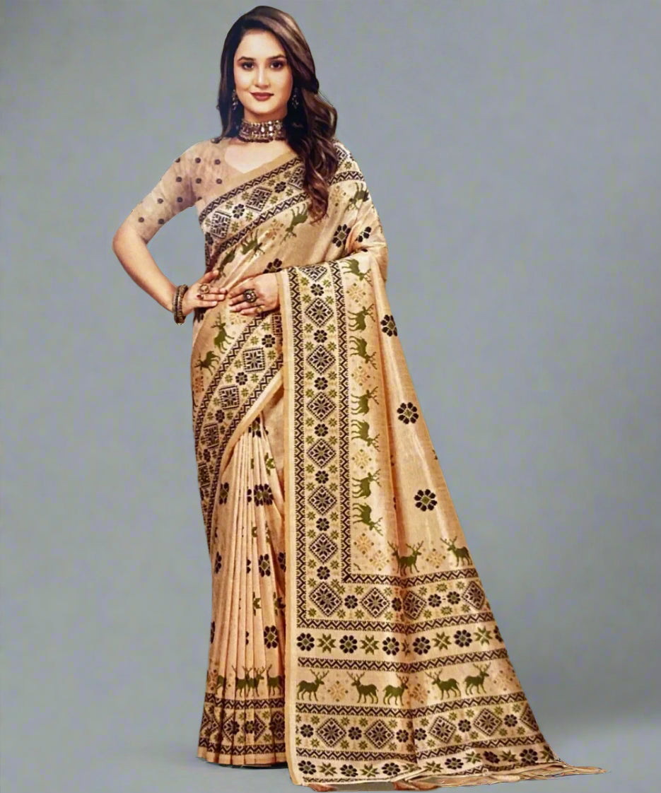 Woman wearing a beige saree with black patterns on a plain background