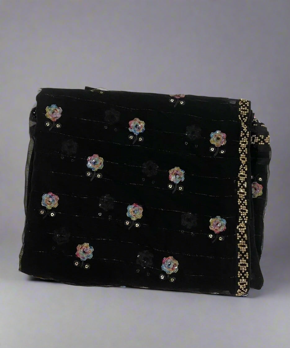 Black saree with floral sequin work.