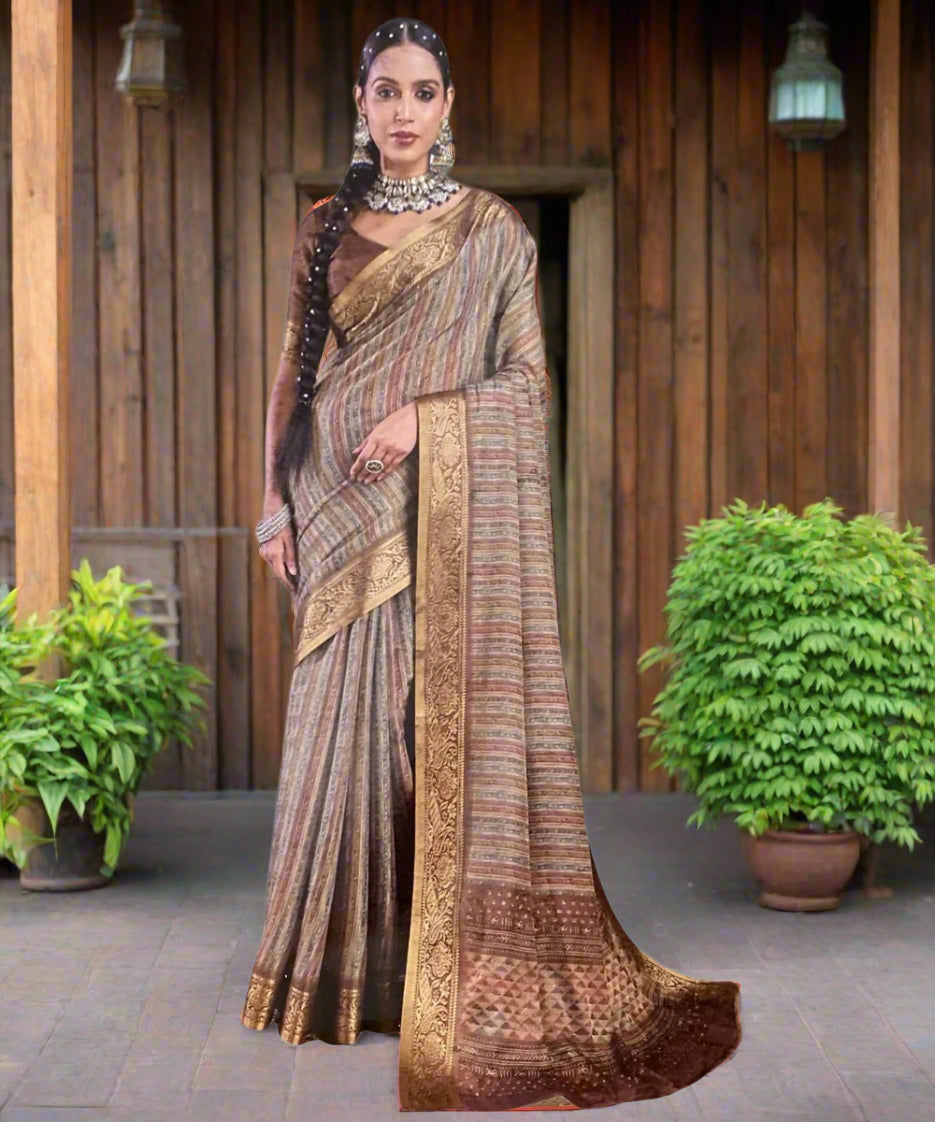 Woman wearing a traditional saree with a grey background