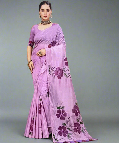 Woman wearing a purple hand-painted saree with floral patterns for diwali on a grey background