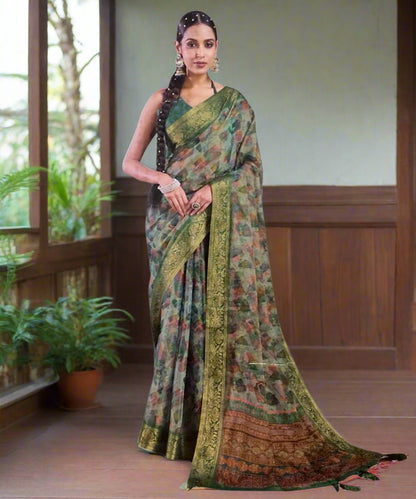 Woman wearing a green saree with a matching blouse perfect for formal events.