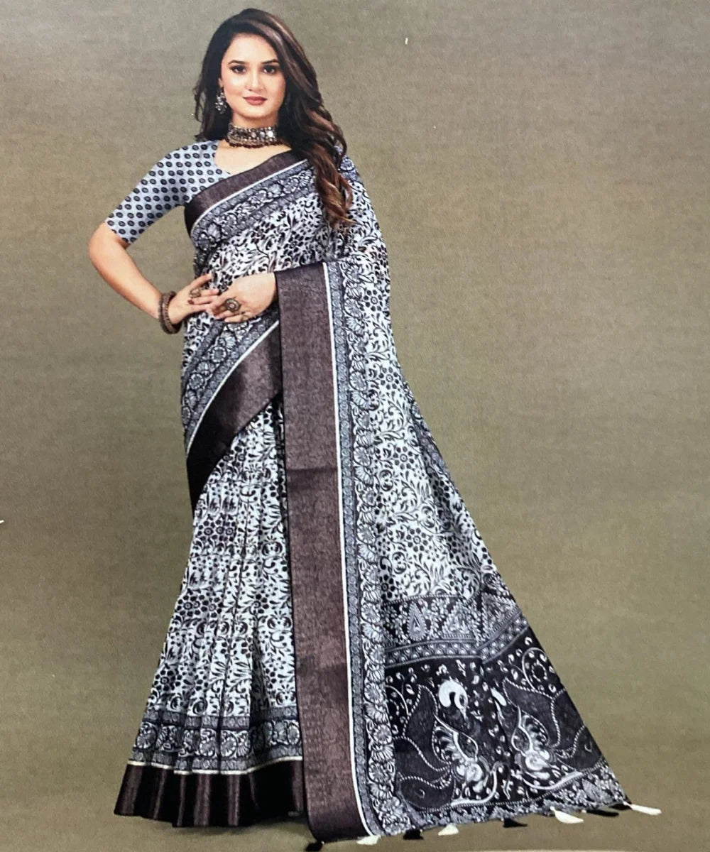 Woman wearing a black and white patterned saree with a border perfect for corporate jobs & events.