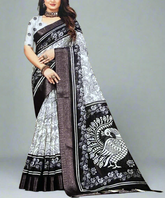 Woman wearing a black and white saree with a pattern on a nice background