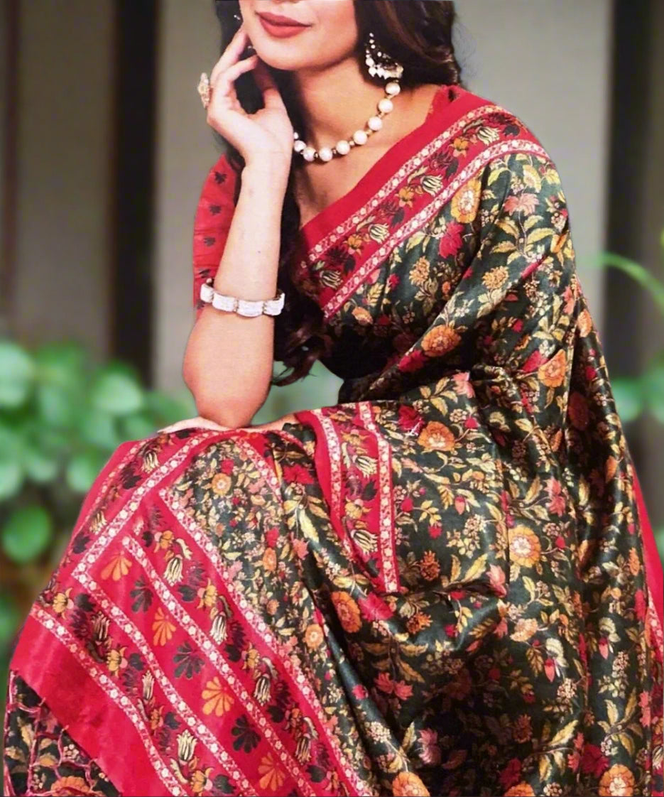 Woman wearing a floral saree with red border perfect for office and gatherings.