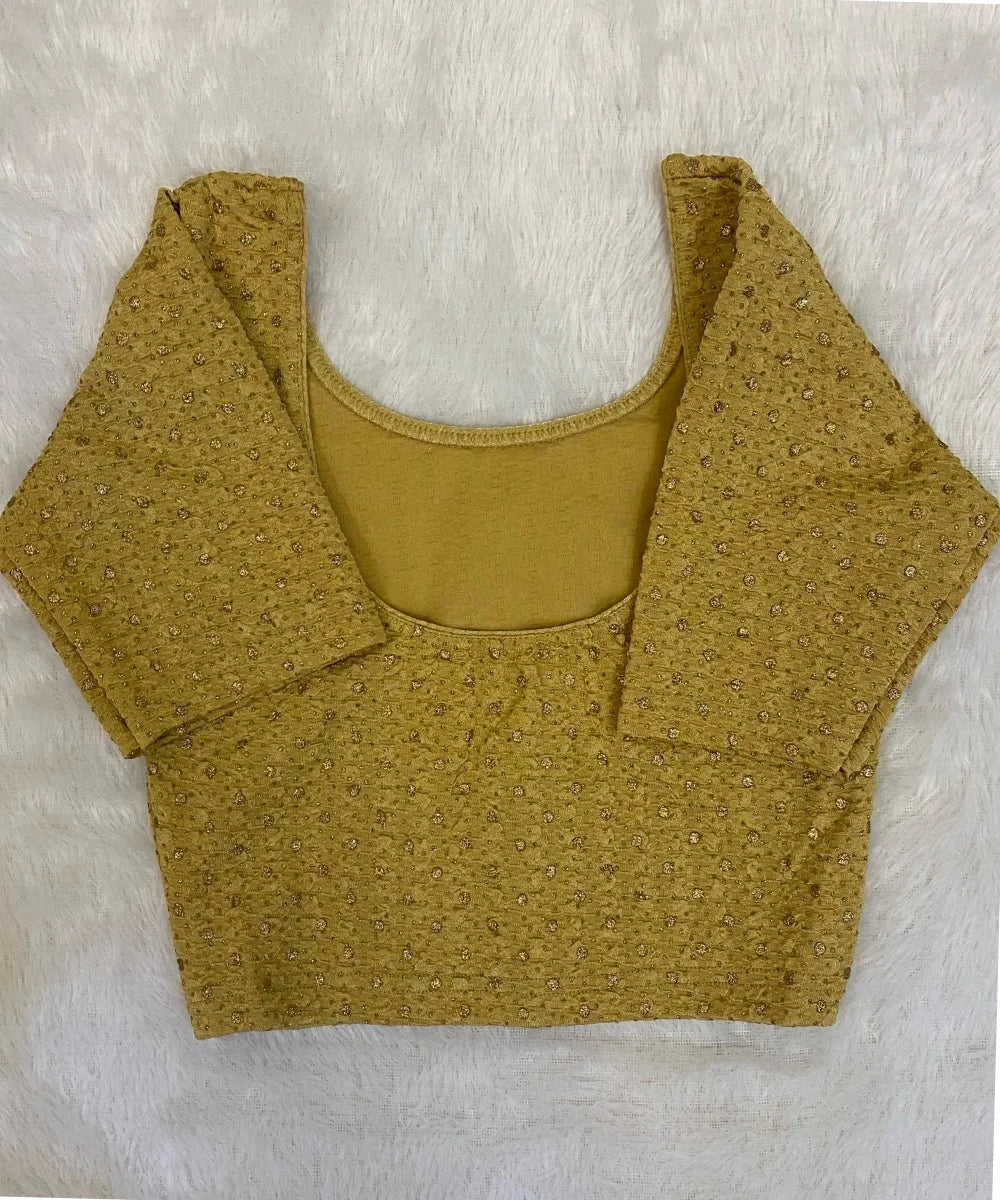 back side of Beige yellow cotton stretchable blouse on a light grey background