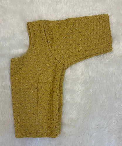 Beige yellow cotton stretchable blouse on a light grey background