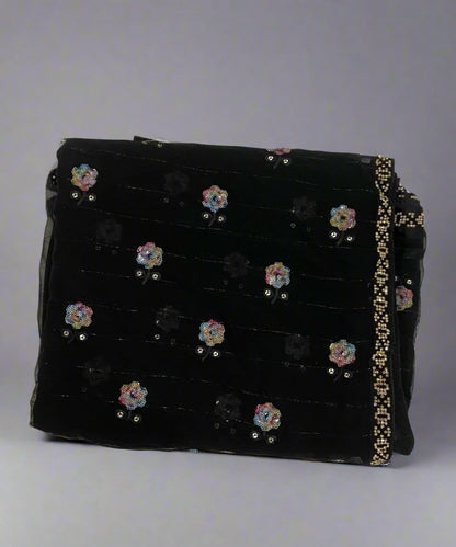 Black saree with floral sequin work.