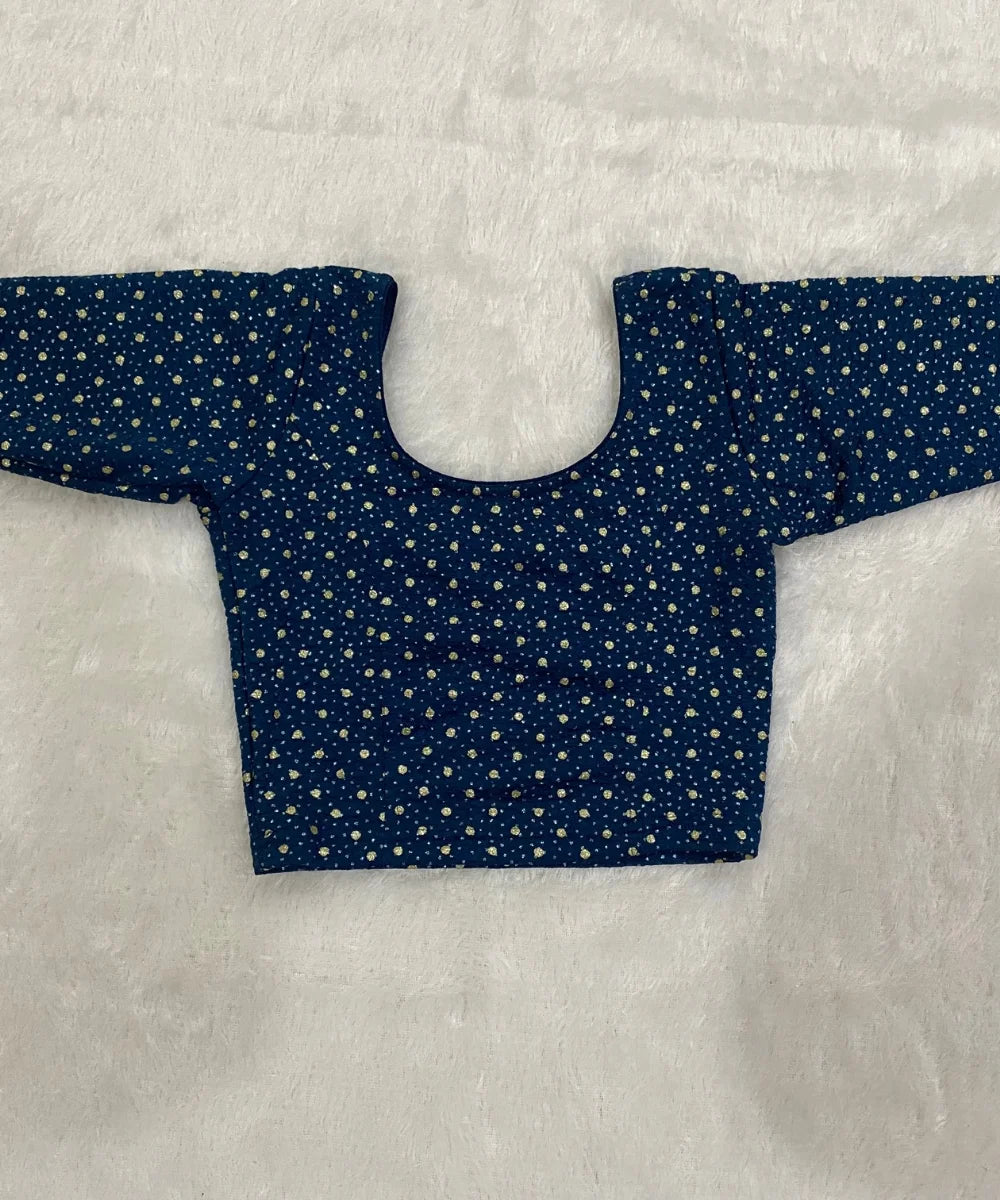 Blue patterned stretchable blouse in cotton material on a light gray background.
