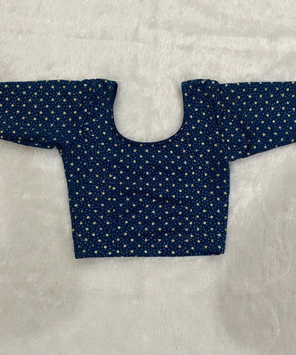 Blue patterned stretchable blouse in cotton material on a light gray background.