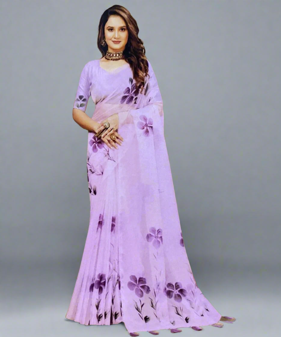 Woman wearing a light purple hand-painted organza saree with floral patterns on diwali.