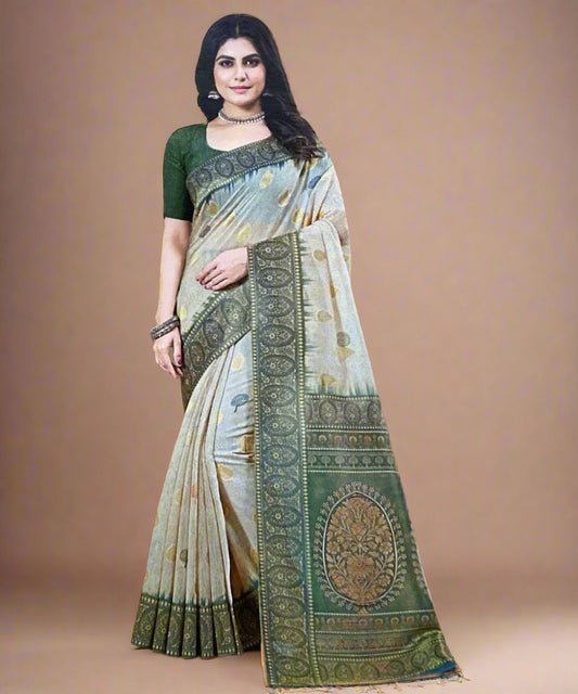 Woman wearing a traditional saree with a green and beige pattern on a brown background