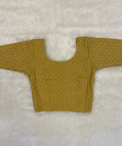 Beige yellow cotton stretchable blouse on a light grey background