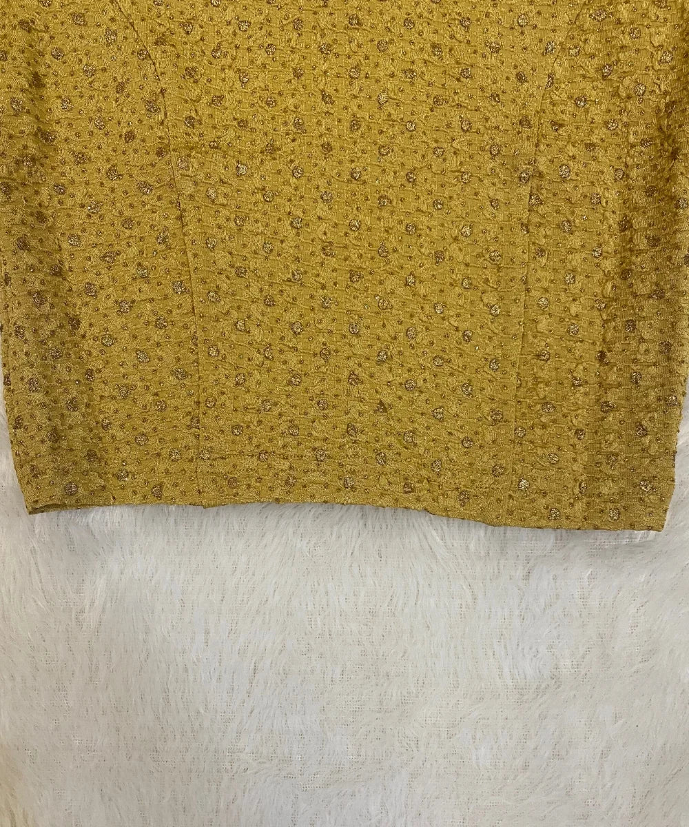 Close-up of a cotton stretchable blouse with a subtle pattern on a white background.