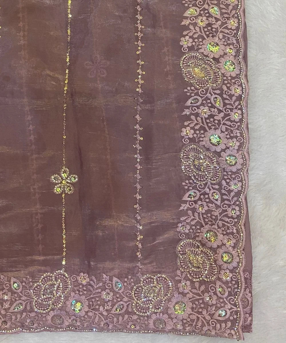 Mauve saree with intricate gold and multicolored beadwork.