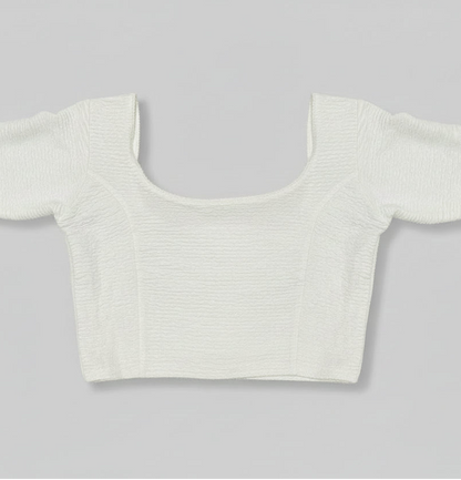 White crop top on a gray background